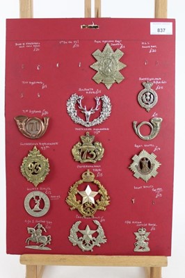 Lot 837 - Four boards mounted with British military cap badges, mainly Scottish regiments, some reproductions noted (approximately 69 badges)