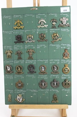 Lot 838 - Five boards mounted with British military cap badges, Lancers, Hussars and Dragoons some reproductions noted (approximately 130 badges)