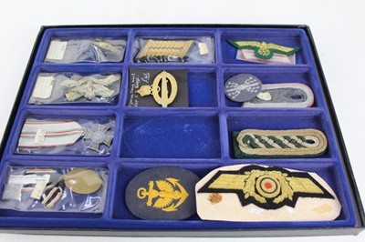 Lot 843 - Three glazed cases containing a collection of American, German and British military badges, some reproductions noted (3 cases)