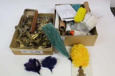 Lot 847 - Two boxes of various military helmet fittings and cap badge clips.