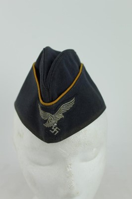 Lot 858 - Second World War Nazi Luftwaffe side cap with yellow piping