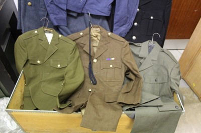 Lot 852 - Large collection of assorted military uniform to include an RAF Great Coat, in a chest on wheels, together with another chest of uniform.