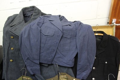 Lot 852 - Large collection of assorted military uniform to include an RAF Great Coat, in a chest on wheels, together with another chest of uniform.