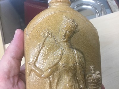 Lot 1 - H.M. Queen Victoria 1837, scarce commemorative Lambeth salt glazed stoneware gin flask decorated in relief with a standing figure of The Queen and The Royal Coat of Arms...