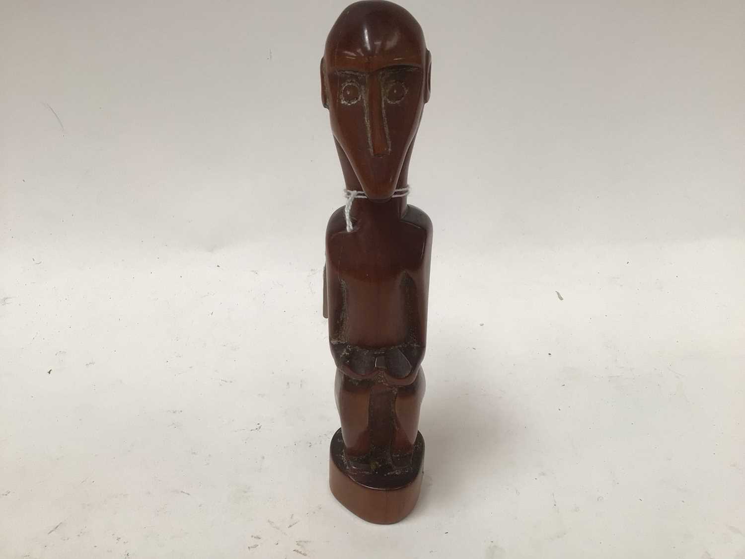 Lot 2635 - African red ivory wood figure of a seated monkey, in the style of the Baboon Master of Southern Africa, 21cm high