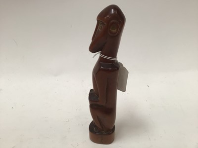 Lot 2635 - African red ivory wood figure of a seated monkey, in the style of the Baboon Master of Southern Africa, 21cm high