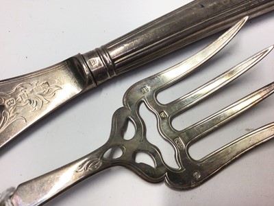 Lot 216 - Pair of Victorian silver fish servers with pierced and engraved decoration, (Sheffield 1856), in fitted case.