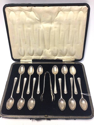 Lot 217 - Set of twelve George V silver tea spoons, together with matching sugar tongs, (mostly assayed Sheffield 1924), in fitted case, all at 6oz
