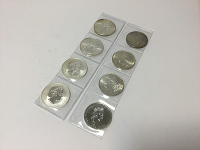Lot 524 - World - Mixed silver bullion coins to include G.B. 'Britannia's 1999 UNC x 2, Canada 'Maple' 2002 UNC, U.S. Dollars 'Morgan' 1886 UNC, 'Peace' 1922, 1923 AU-UNC and 'Liberty' 1993 & 2003
