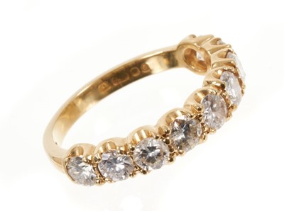 Lot 529 - Diamond nine stone half hoop eternity ring