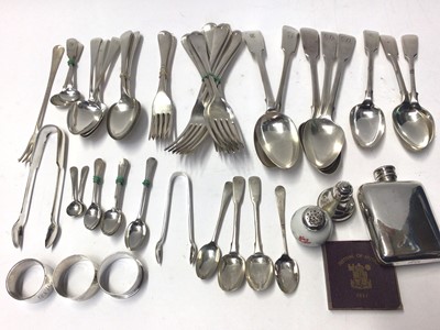 Lot 223 - Three Georgian fiddle pattern table spoons, together silver napkin rings, other silver flatware and quantity of plated flatware, 16oz of weighable silver.