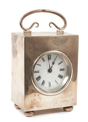 Lot 601 - Archibald Knox style silver carriage clock.