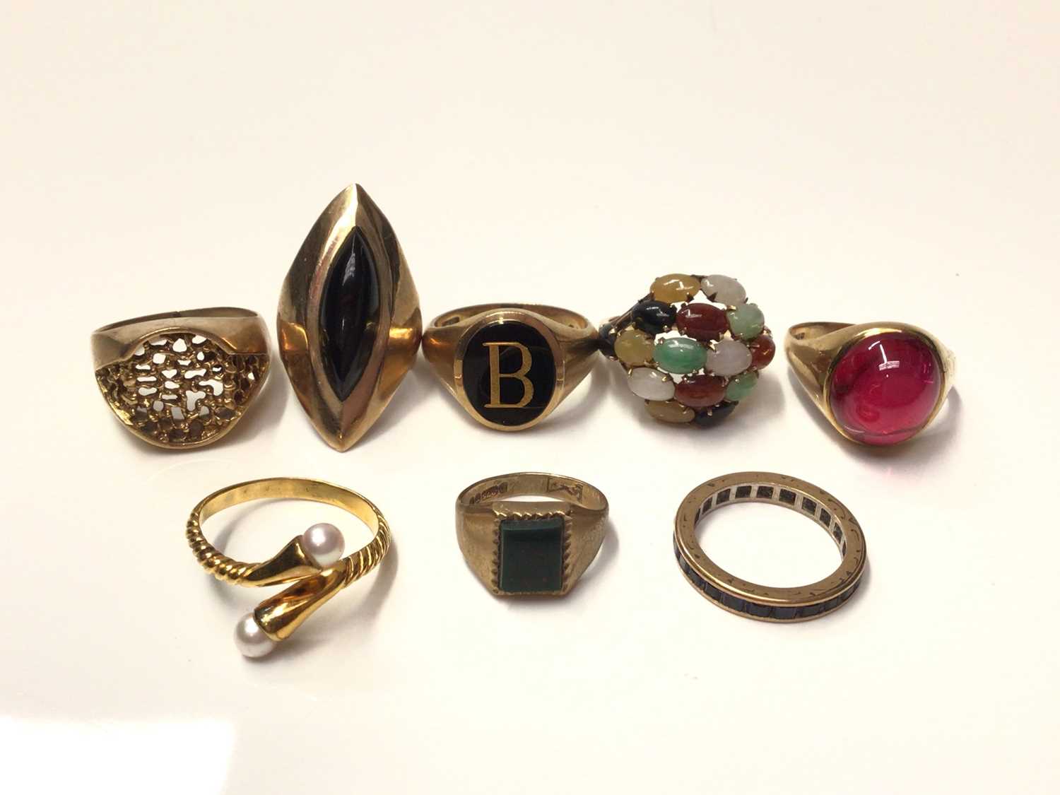 Lot 264 - Eight gold and gem-set dress rings