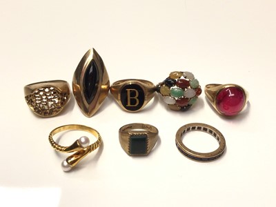 Lot 264 - Eight gold and gem-set dress rings