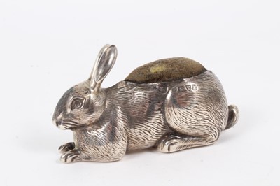 Lot 235 - Edwardian novelty pin cushion in the form of a seated Rabbit, (Chester 1908), 6.5cm in length