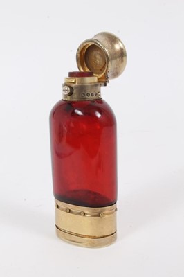 Lot 241 - Victorian silver gilt combination cranberry glass scent bottle and vinaigrette, (London 1866), 9cm in length