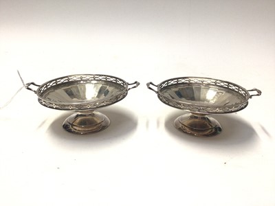 Lot 255 - Pair of George V silver twin handled bonbon dishes, (Birmingham 1925), maker Docker & Burn Ltd, each 13.6cm in diameter, all at 5.6oz