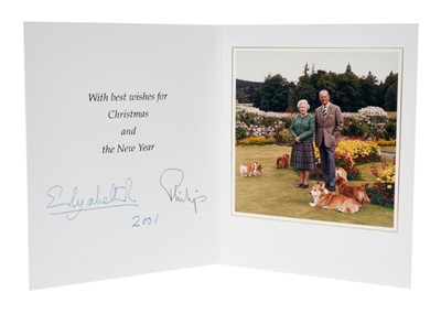 Lot 13 - H.M. Queen Elizabeth II and H.R.H. The Duke of Edinburgh, signed 2001 Christmas card with twin gilt ciphers to cover,colour photograph of the Royal couple with their Corgis to the interior with env...