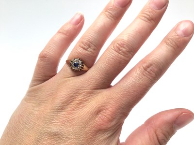 Lot 306 - Victorian sapphire and diamond cluster ring with a round mixed cut blue sapphire surrounded by eight diamond in gold setting, size L