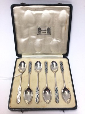 Lot 283 - Set of six George VI silver and enamel teaspoons, (Birmingham 1937), maker Liberty & Co, in original Liberty & Co fitted case.