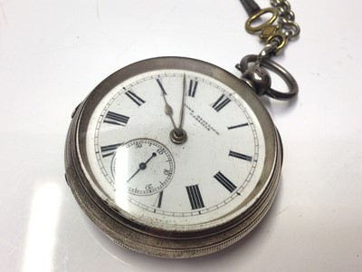Lot 285 - Victorian silver open faced pocket watch, (London 1874) with a silver albert chain, together with a Swiss silver open face pocket watch, retailled by Kendal & Dent (3)