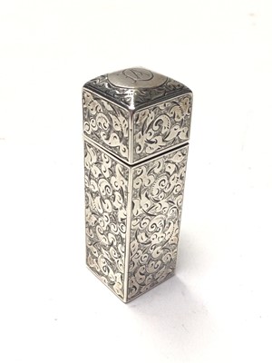 Lot 293 - Victorian silver scent bottle of rectangular form, with engrarved decoration, hinged lid with glass stopper to interior, (London 1887), maker Sampson & Mordan, 5.5cm in overall length