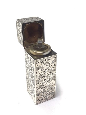 Lot 293 - Victorian silver scent bottle of rectangular form, with engrarved decoration, hinged lid with glass stopper to interior, (London 1887), maker Sampson & Mordan, 5.5cm in overall length