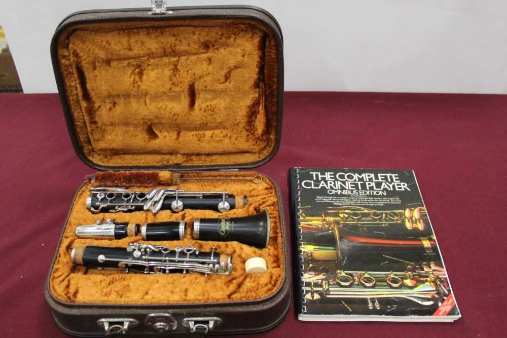 Lot 2252 - Corton clarinet in case, together with a lesson book