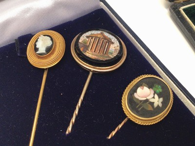 Lot 316 - Group of four 19th century Italian stick pins to include two micromosaic stick pins, carved hardstone cameo stick pin and a pietra dura stick pin (4)