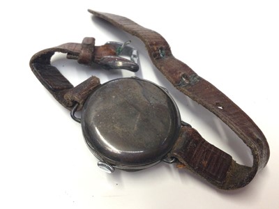 Lot 321 - First World War period silver trench wrist watch with white enamel arabic numeral dial with subsiduary seconds, (import marks for Birmingham 1911), on leather strap.