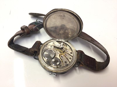 Lot 321 - First World War period silver trench wrist watch with white enamel arabic numeral dial with subsiduary seconds, (import marks for Birmingham 1911), on leather strap.