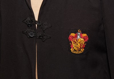 Lot 811 - Harry Potter interest - An original prop Gryffindor cloak from Harry Potter and the Goblet of Fire.  Provenance: Given to Alba Diaferia during a magical day on the Warner Brothers film set, arrange...