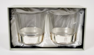 Lot 162 - H.M Queen Elizabeth II 2010 Royal Household Christmas present pair Whiskey glasses with plated collars and crowned ER II ciphers - Christmas 2010