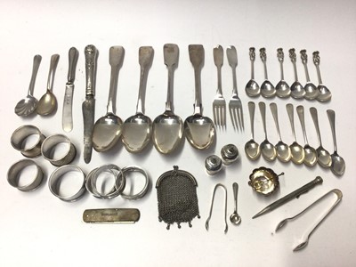 Lot 325 - Three Georgian silver fiddle pattern table spoons, together with a quantity of silver flatware, napkin rings and other silver.