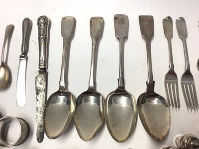 Lot 325 - Three Georgian silver fiddle pattern table spoons, together with a quantity of silver flatware, napkin rings and other silver.
