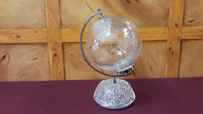 Lot 1147 - A Waterford Crystal World Globe with cut-glass decoration within chromium support upon a cut-glass circular base