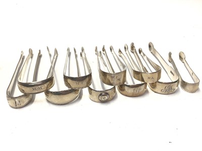 Lot 328 - Ten pairs of George III silver sugar tongs, most with bright cut engraved decoration, various dates and makers, mostly circa 1800, all at approximately 10oz, (10)