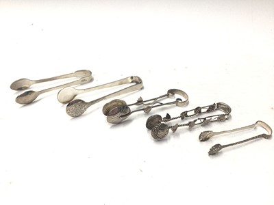 Lot 332 - Five pairs of Chinese and Japanese silver and white metal sugar tongs, to include Wang Hing, Yat Sun and others, all at approximately 4oz, (10)