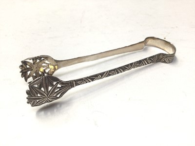 Lot 332 - Five pairs of Chinese and Japanese silver and white metal sugar tongs, to include Wang Hing, Yat Sun and others, all at approximately 4oz, (10)