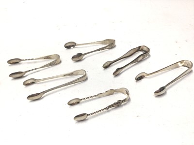 Lot 334 - Twenty pairs of Victorian and early 20th century silver sugar tongs,  various dates and makers, all at approximately 10oz, (20)