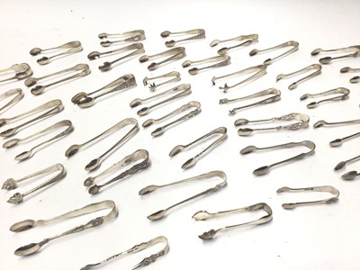 Lot 335 - Thirty Eight pairs of Victorian and early 20th century silver sugar tongs, various dates and makers, all at approximately 21oz, (38)