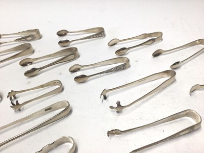 Lot 335 - Thirty Eight pairs of Victorian and early 20th century silver sugar tongs, various dates and makers, all at approximately 21oz, (38)