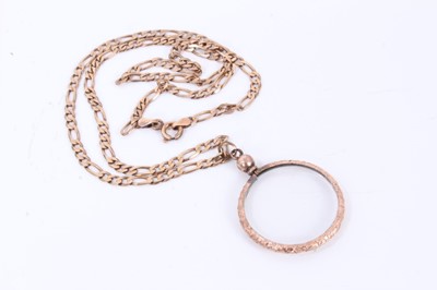 Lot 588 - Antique gilt metal circular locket on a modern 9ct gold chain