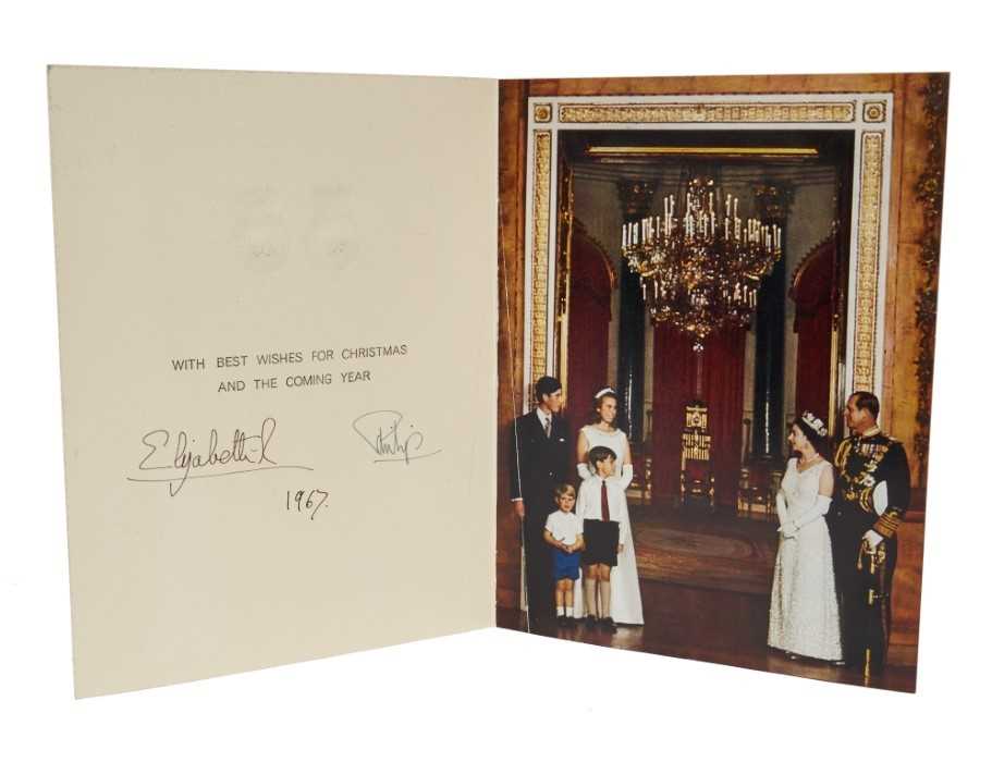 Lot 33 - H.M. Queen Elizabeth II and H.R.H. The Duke of Edinburgh - signed 1963 Christmas card with twin Royal ciphers to cover, photograph to the interior of the Royal Family at Buckingham Palace