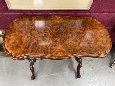 Lot 1213 - Victorian burr walnut veneered card table with shaped fold-over top on carved and turned supports with turned stretcher on cabriole legs terminating on original ceramic casters