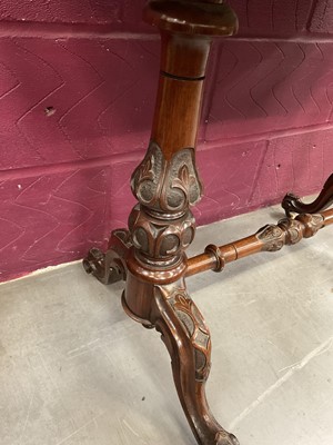 Lot 1213 - Victorian burr walnut veneered card table with shaped fold-over top on carved and turned supports with turned stretcher on cabriole legs terminating on original ceramic casters