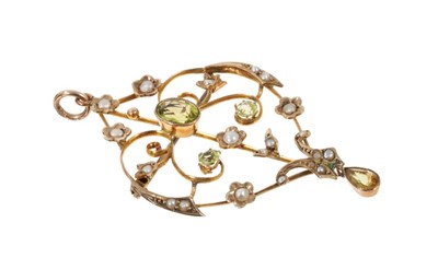 Lot 534 - Edwardian peridot and seed pearl pendant brooch with openwork foliate scrolls, 54mm