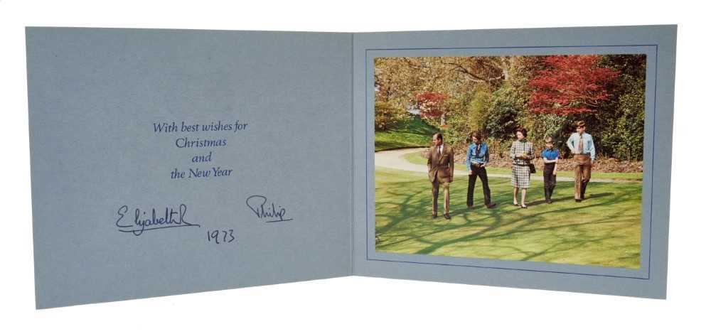 Lot 38 - H.M. Queen Elizabeth II and H.R.H. The Duke of Edinburgh, signed 1973 Christmas card with twin gilt Royal ciphers to cover, colour photograph of the Royal Family in a garden to interior