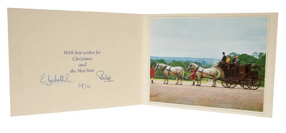 Lot 39 - H.M. Queen Elizabeth II and H.R.H. The Duke of Edinburgh, signed 1974 Christmas card with twin gilt Royal ciphers to cover, colour photograph of the Royal Family on a carriage to interior