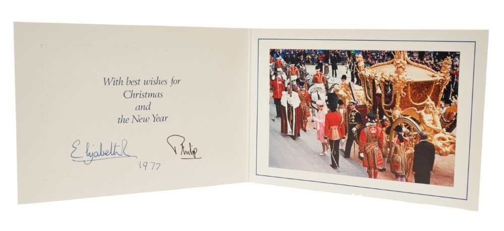 Lot 42 - H.M. Queen Elizabeth II and H.R.H. The Duke of Edinburgh, signed 1977 Christmas card with twin gilt Royal ciphers to cover, colour photograph of The Queen and Duke arriving at the Silver Jubilee Th...